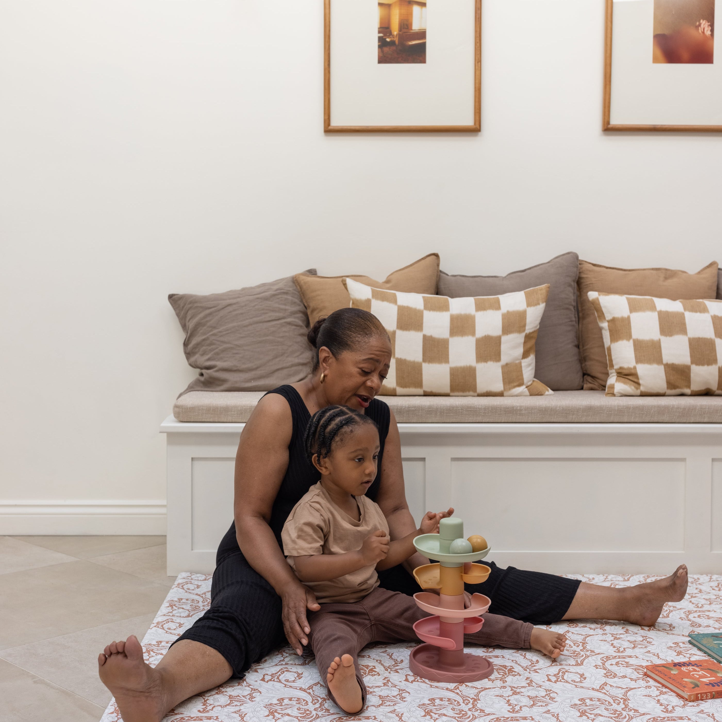 family playing on a comfortable safe supportive memory foam playmat from totter and tumble