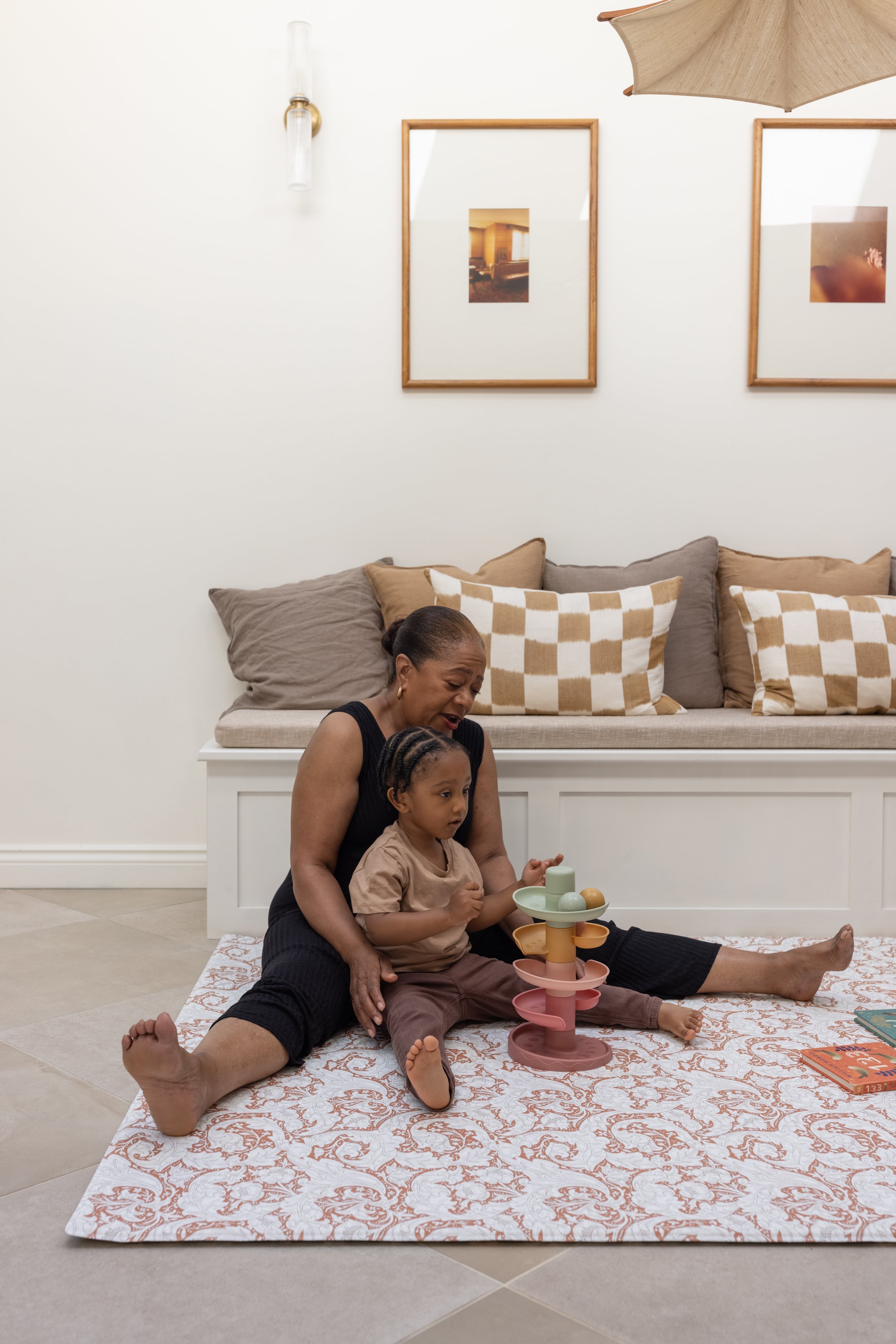 family playing on a comfortable safe supportive memory foam playmat from totter and tumble