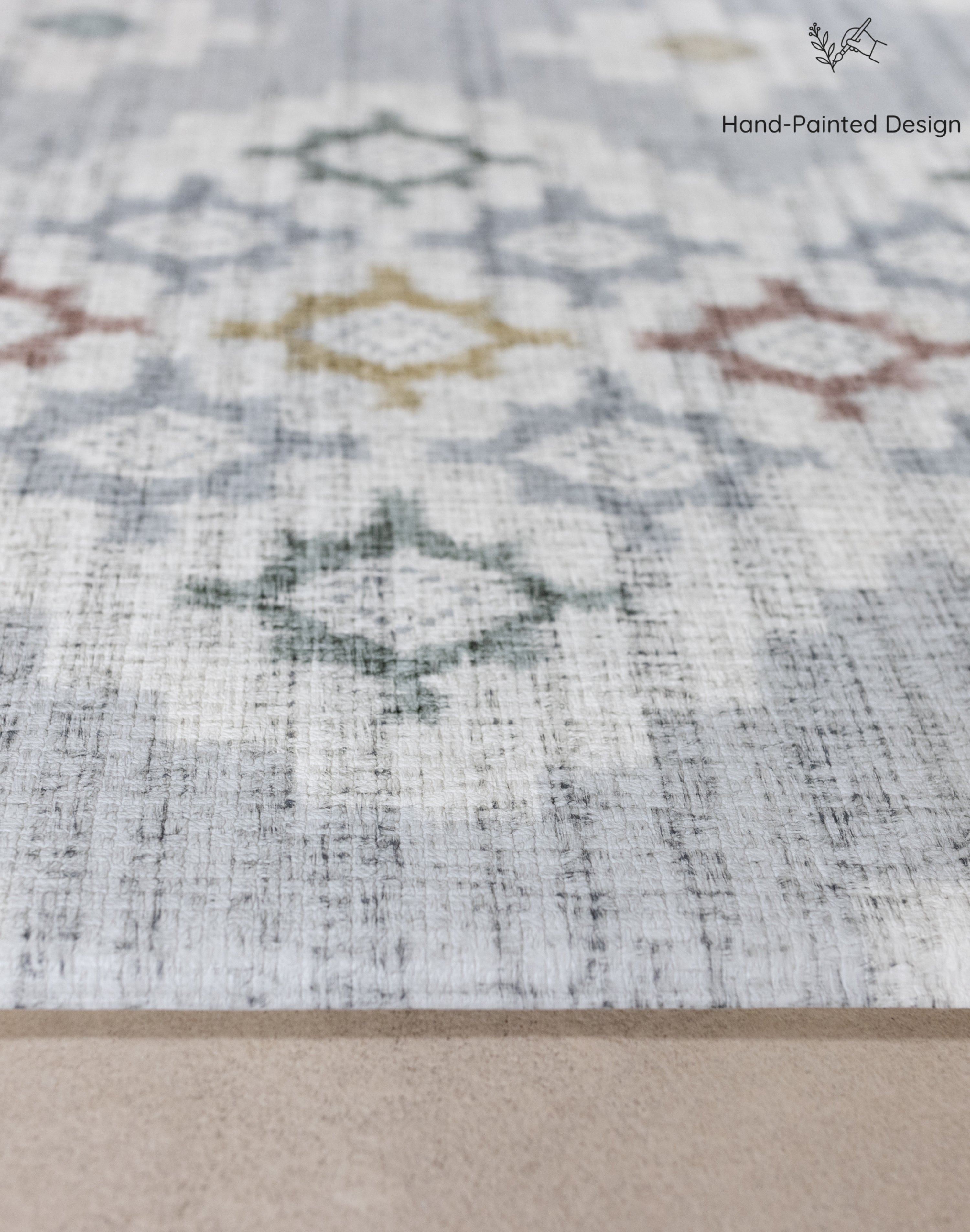 Close-up of a patterned play mat with geometric designs on a neutral background