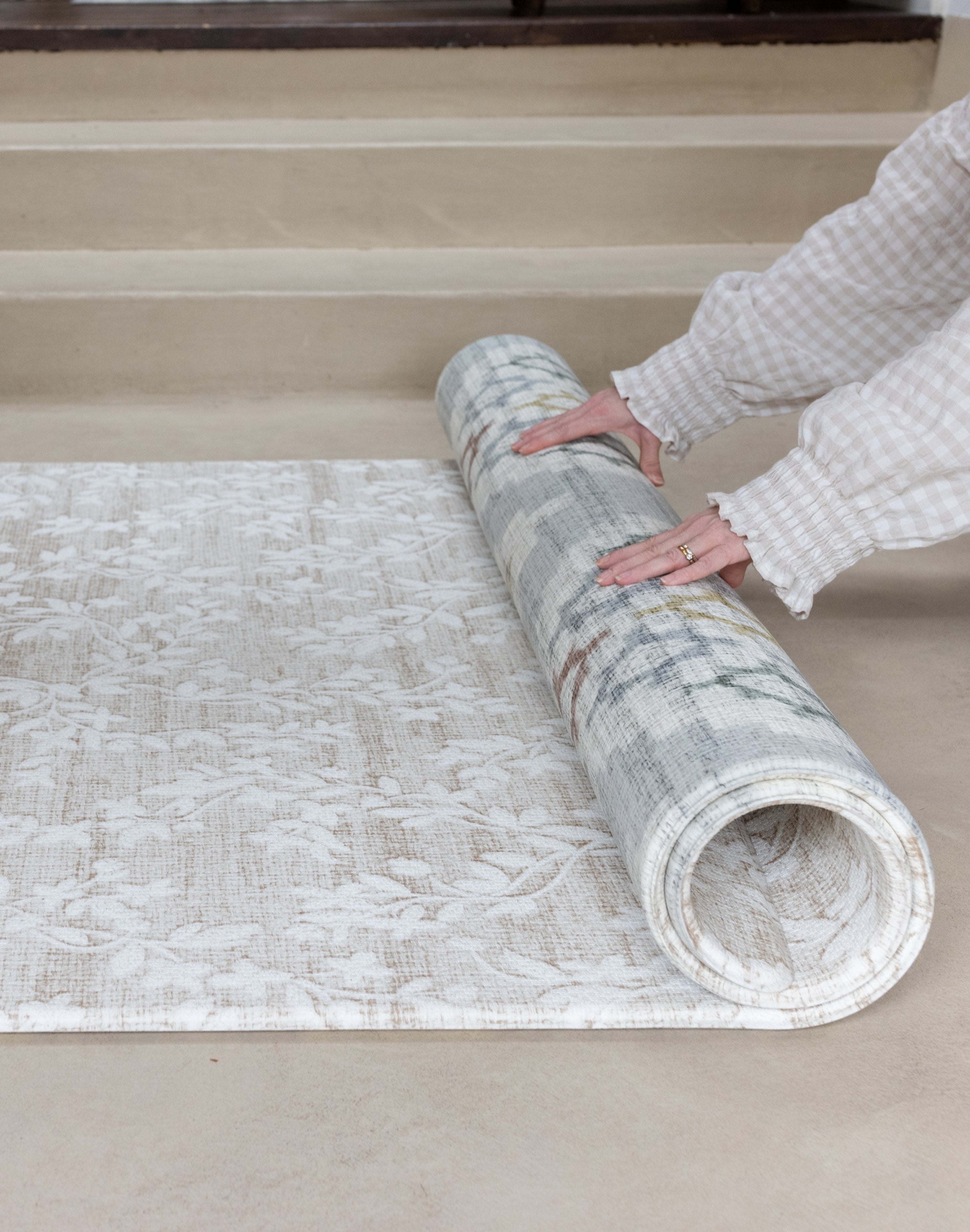 thick memory foam reversible play mat being rolled up