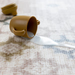 spilt milk on a easy to clean, wipeable play mat