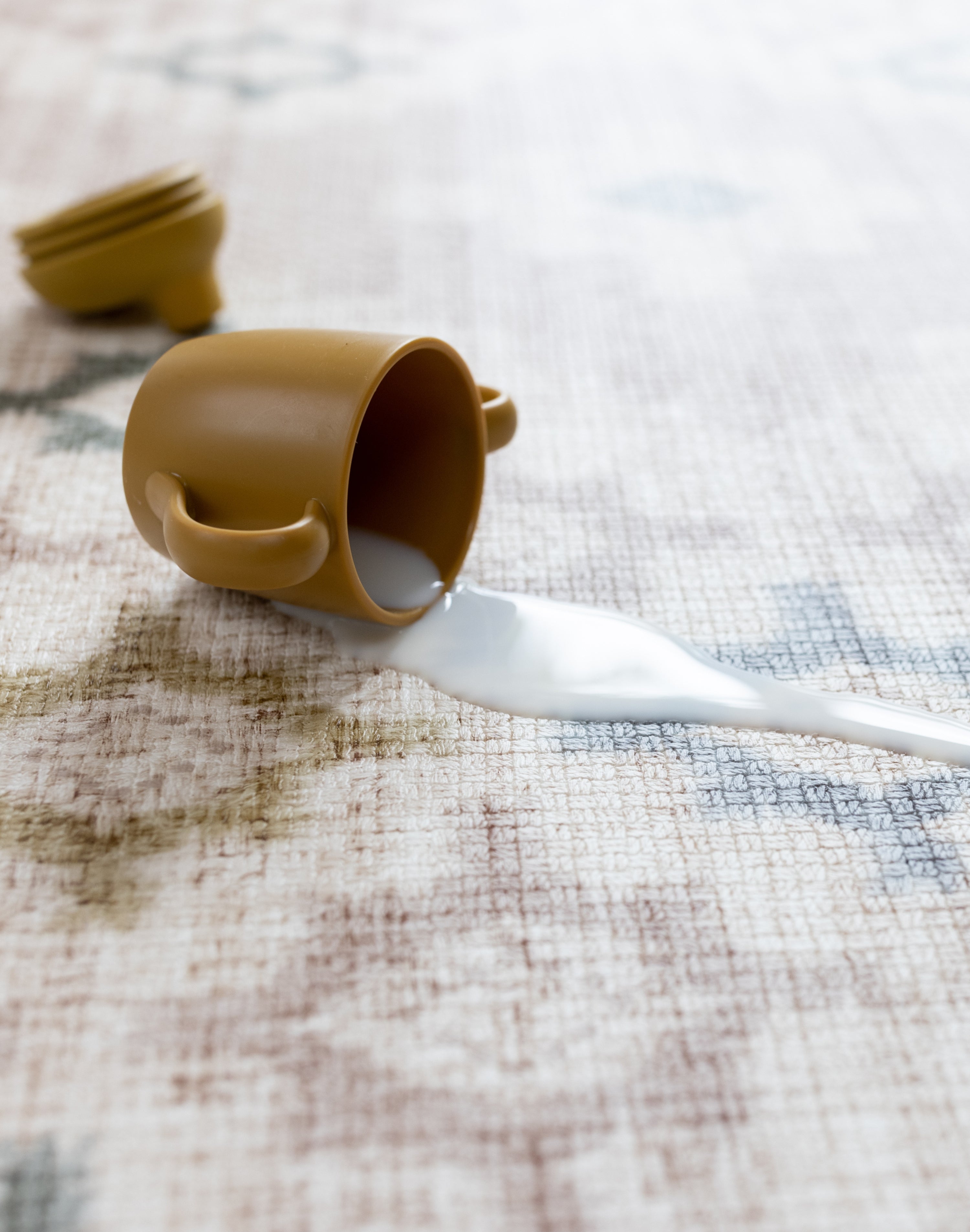 spilt milk on a easy to clean, wipeable play mat