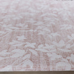 Close-up of textured pink rug-like thick memory foam play mat