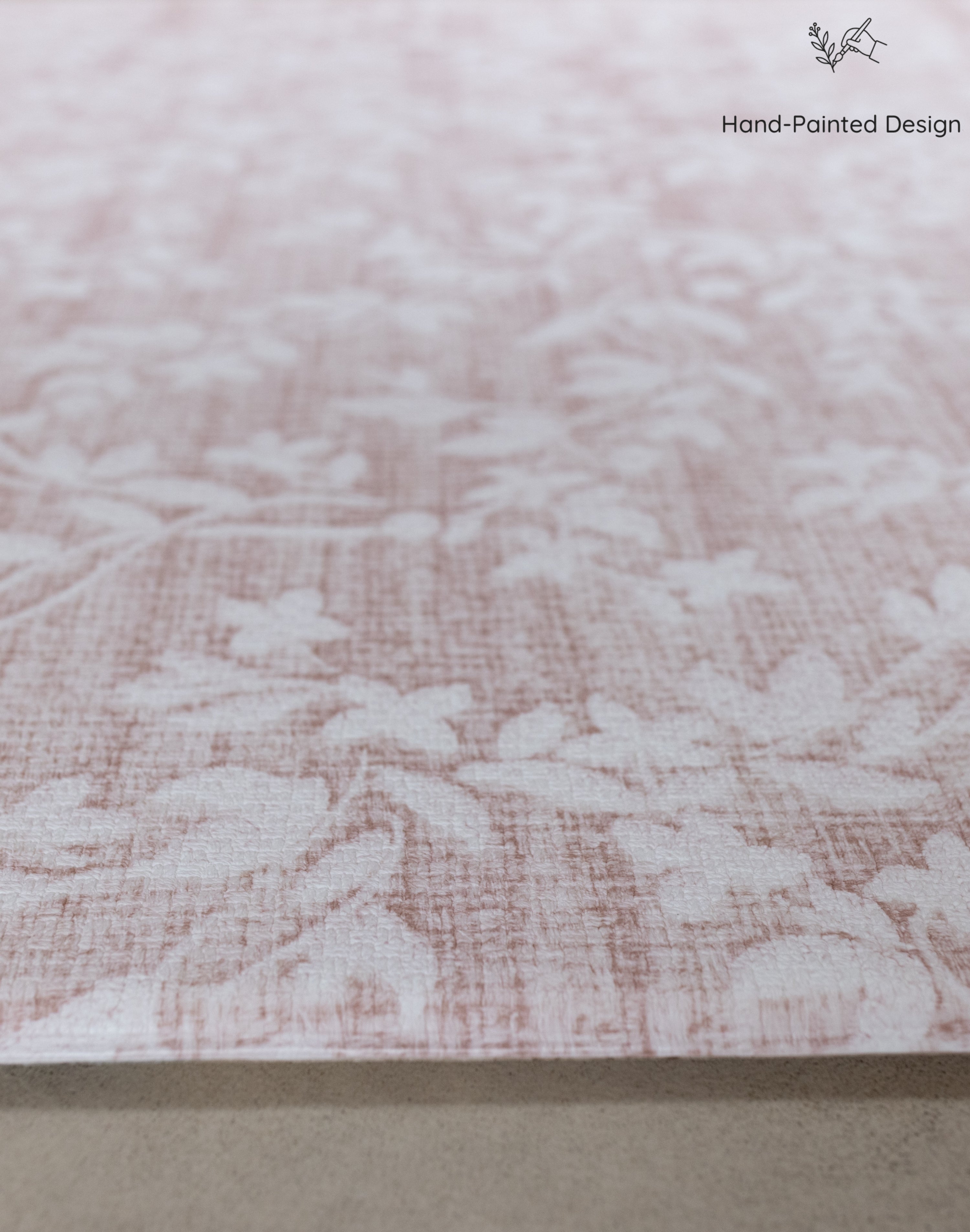Close-up of textured pink rug-like thick memory foam play mat