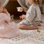 two children sat on a comfortable memory foam baby safe play mat