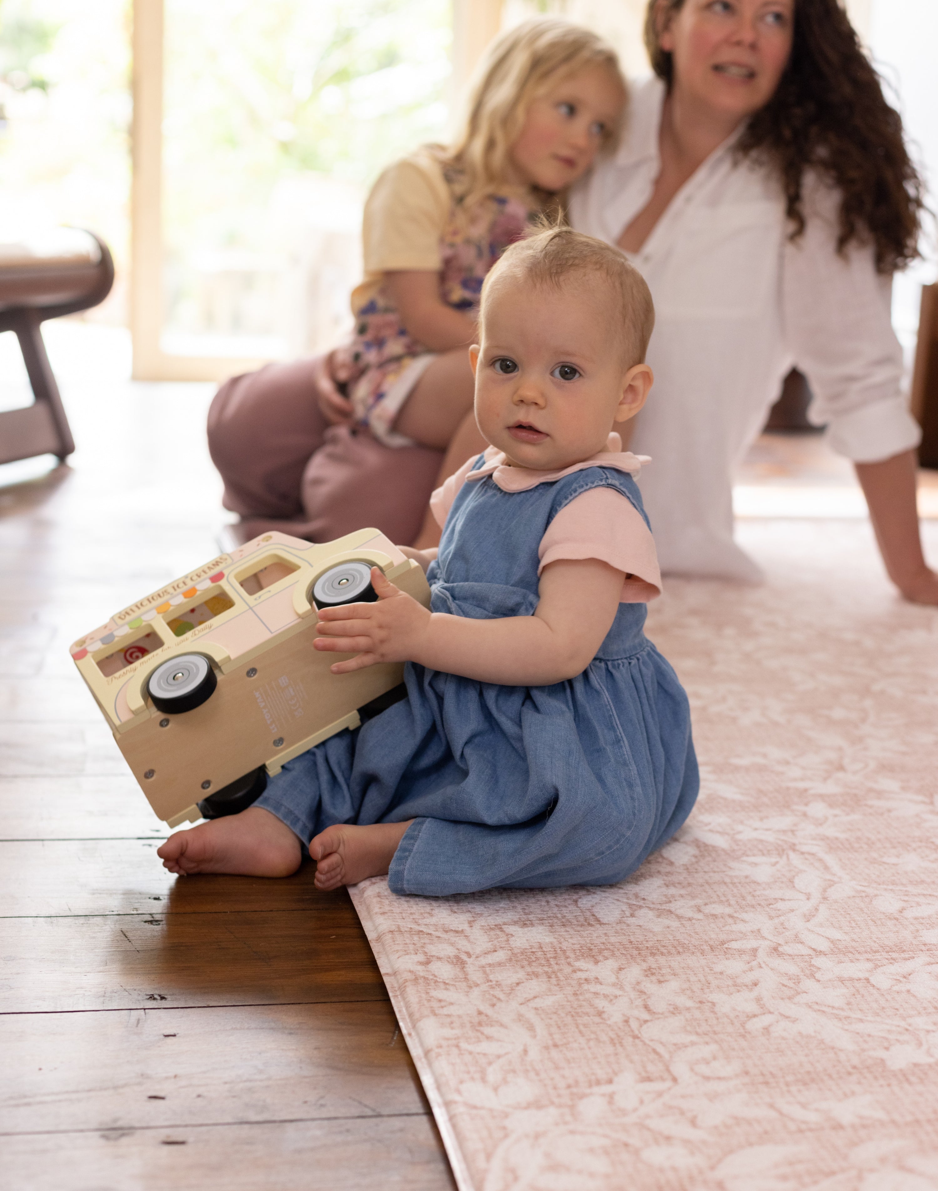Child sat on a thick comfortable memory foam totter and tumble play mat