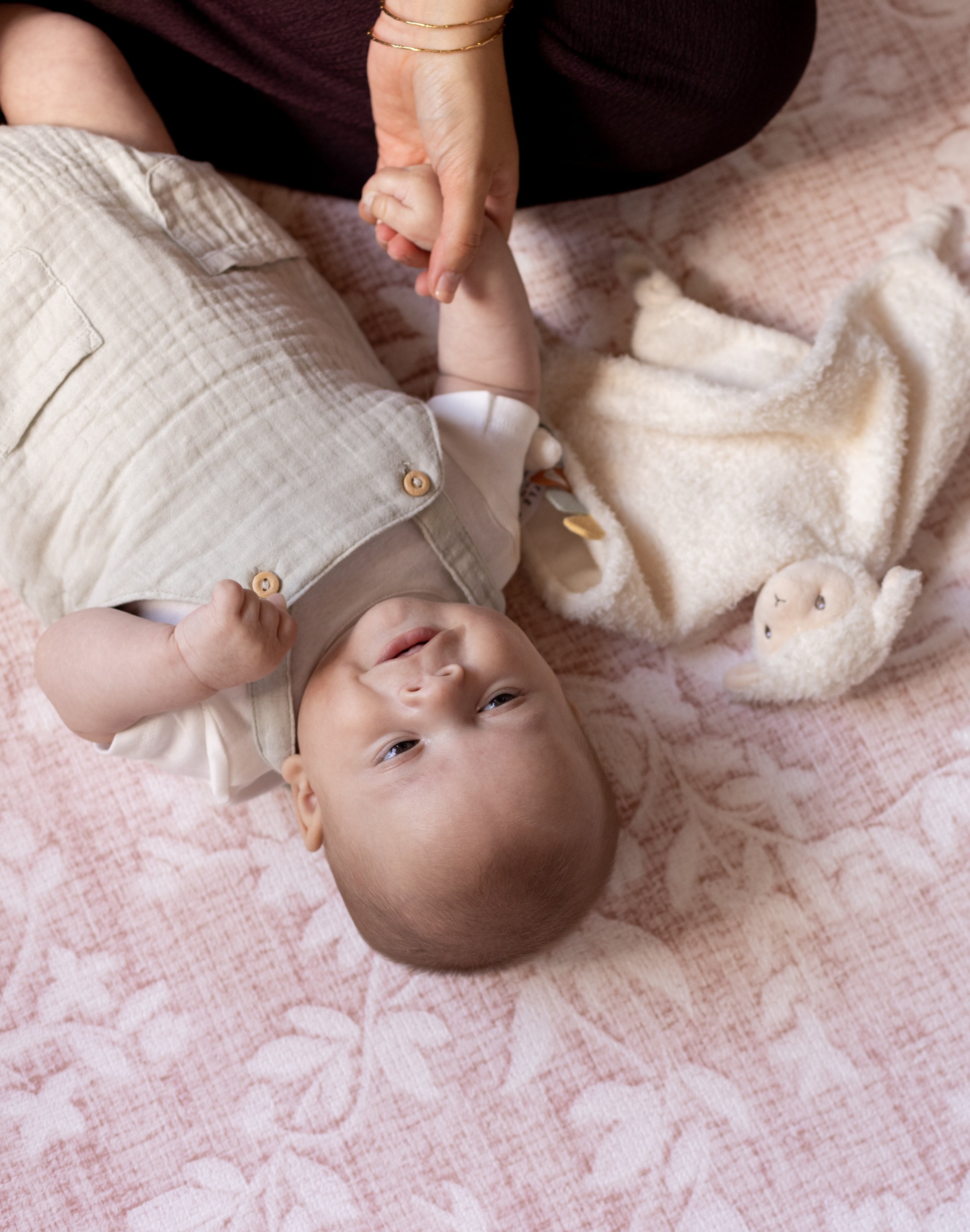 Baby lying on a soft safe non toxic play mat