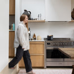 totter and tumble aster runner play mat in a kitchen