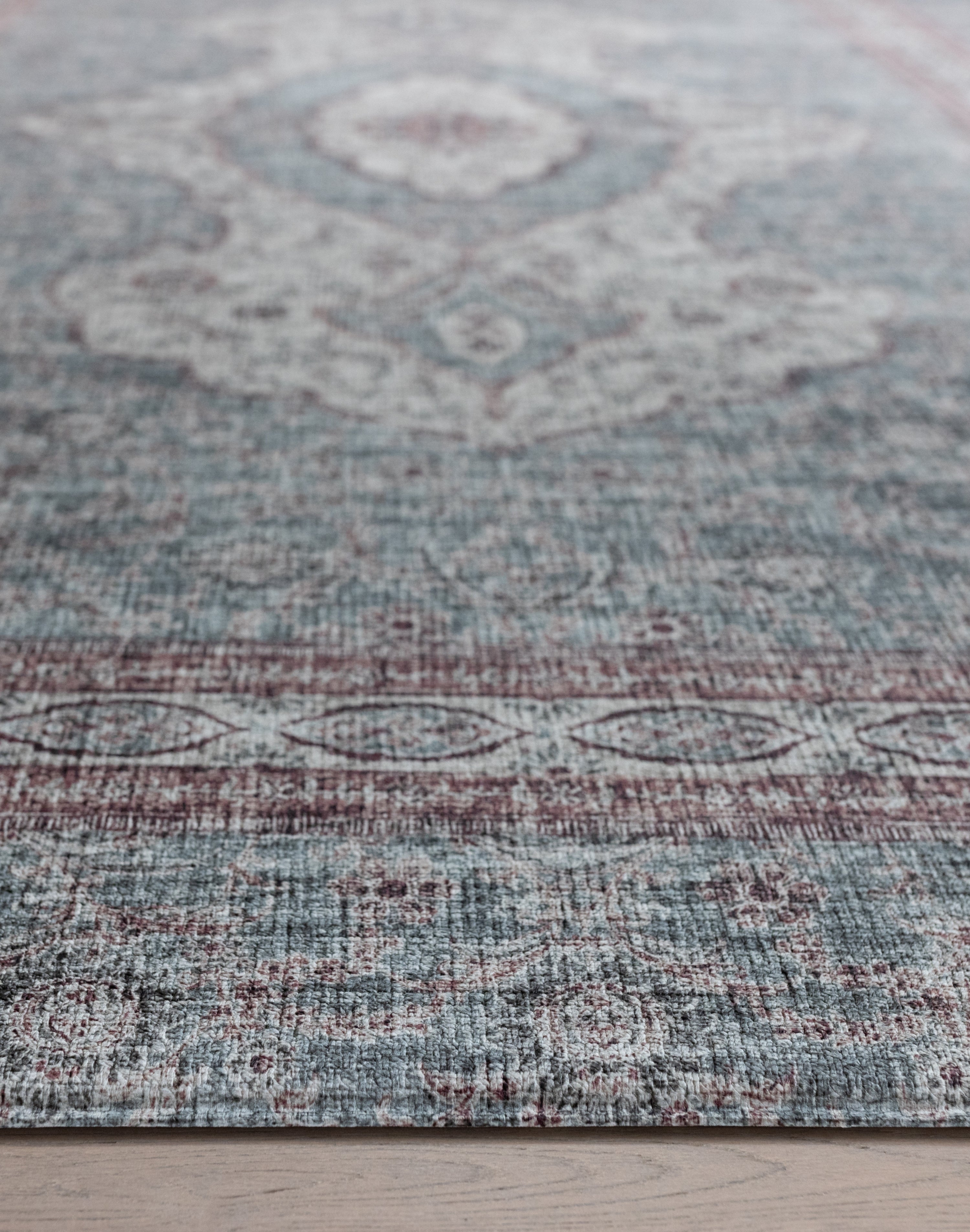 Detailed close-up of Totter & Tumble play rug surface and vintage style pattern.