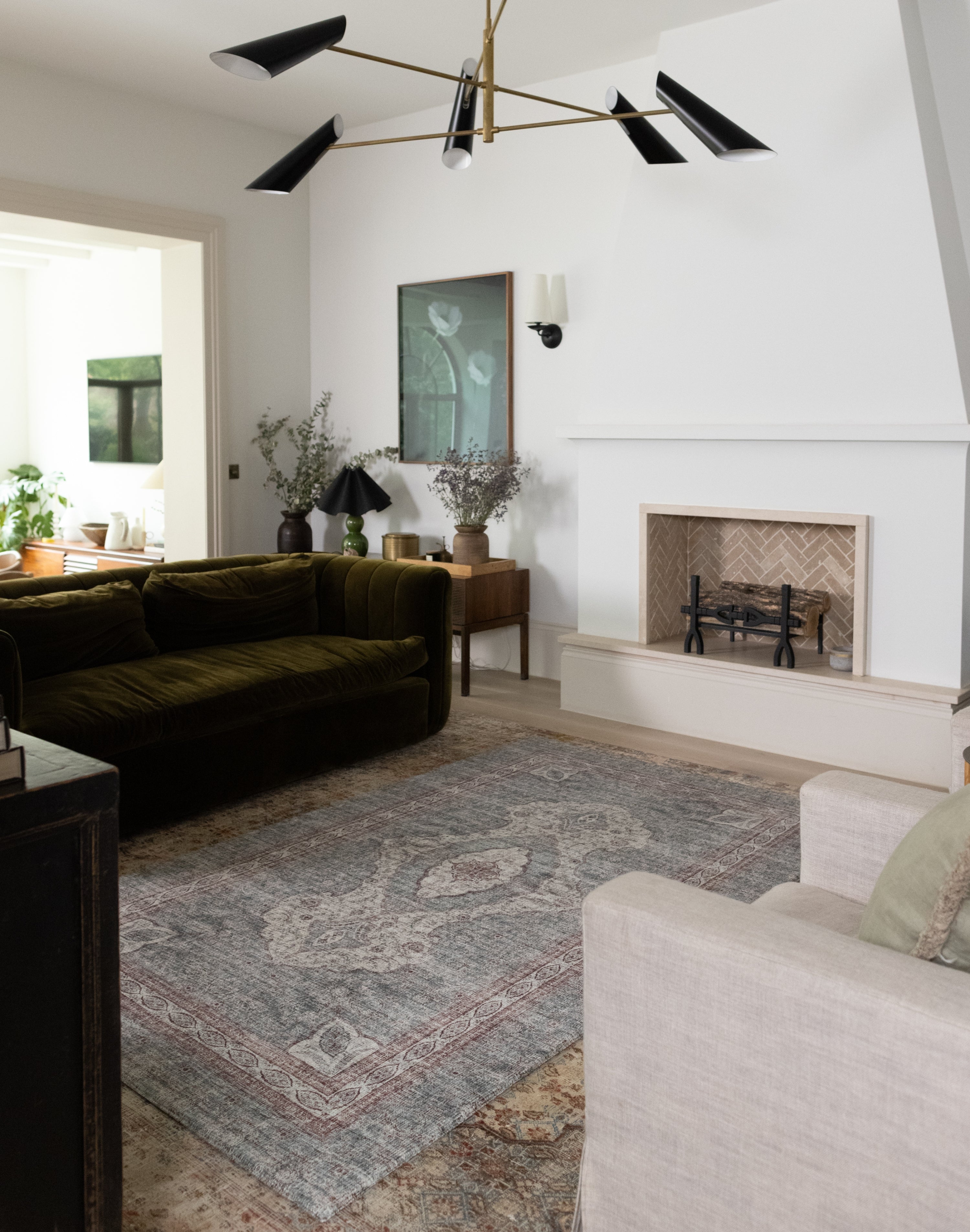 Totter + Tumble play mat rug adding comfort and style to a large family room.