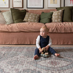 Young child playing on Totter + Tumble soft washable play mat.