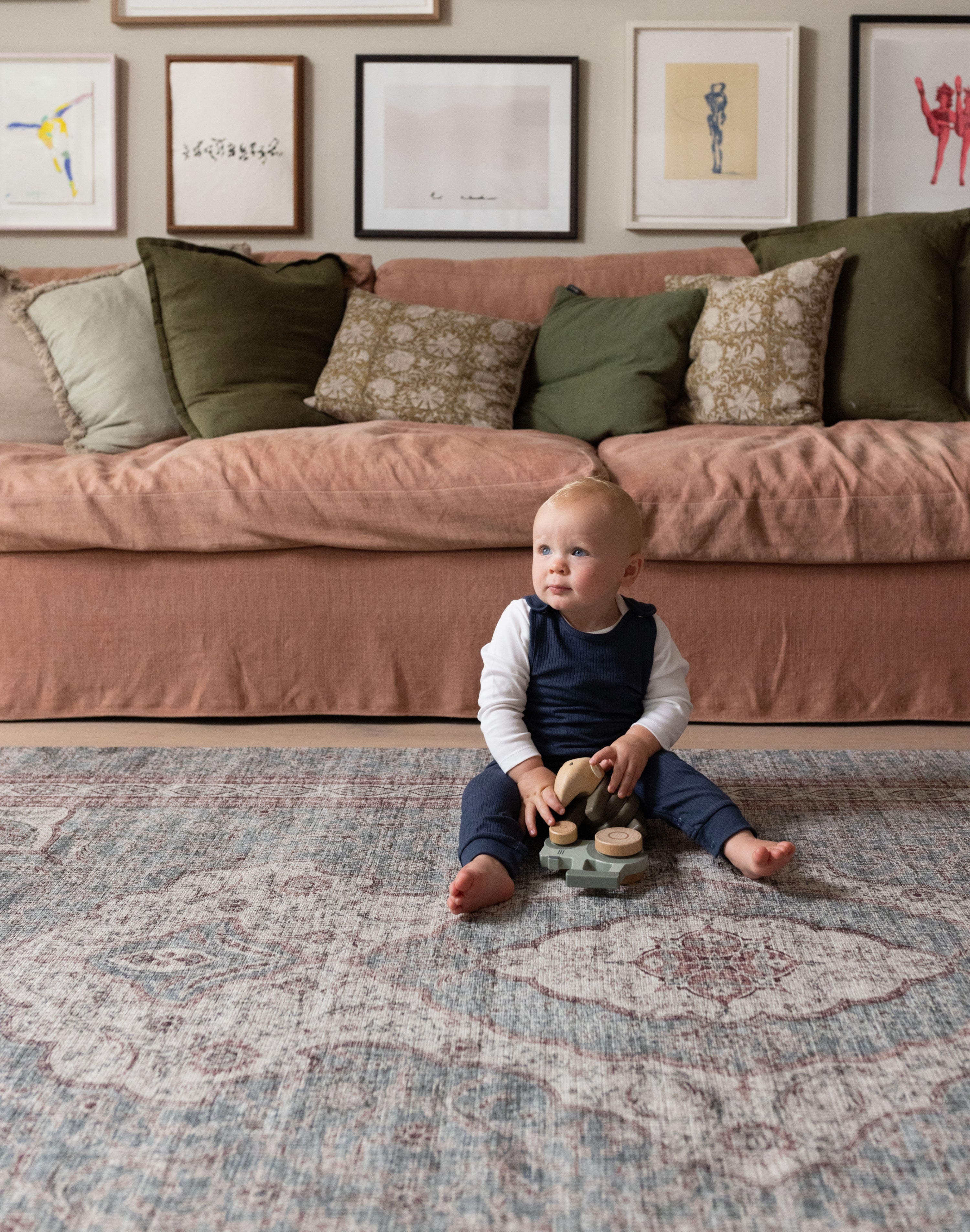 Young child playing on Totter + Tumble soft washable play mat.
