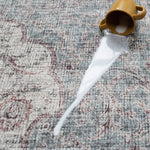 Drink spill on Totter & Tumble mat showing easy-wipe, waterproof surface.