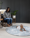 Large round play mat by Totter and Tumble acts like a wipeable area rug in the family home easy to clean spit up and spillages and looks stylish