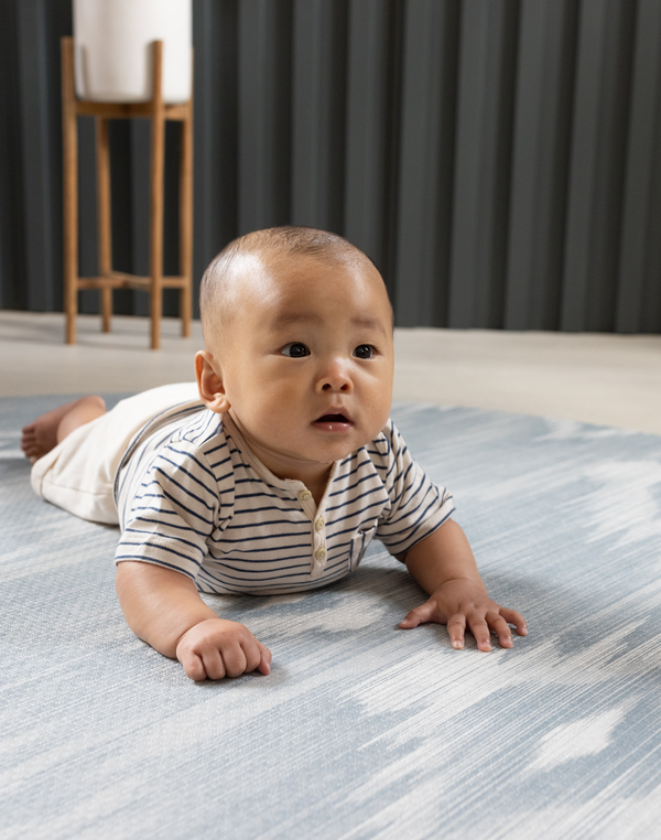 Tummy time on Baby mats by Totter and Tumble are designed with the whole family in mind the Atlas ikat design looks beautiful in the home while the memory foam protects and moulds