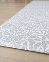 morris & co acorn print close up in neutral grey padded play mat