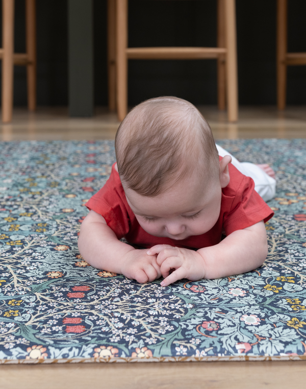 totter and tumble baby playing on play mats perfect for tummy time soft yet supportive foam floor mats