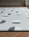Closer look at the rug like floor mat with a design lead motif and textured surface