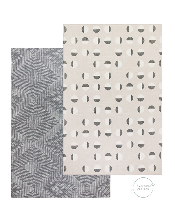 Tan play mat with eclipse inspired motif with a dark grey play mat on the reverse featuring a textile kilim design easy to flip from one side to the other so you can change your interior style simply 