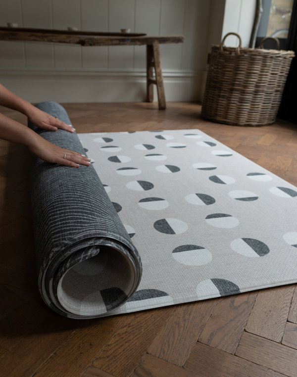 Modern one piece grey memory foam mat designed as an alternative to an area rug for practical family living