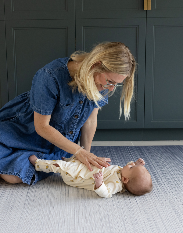 Mom and baby play on Tumbling mats by Totter and Tumble keep floor time safe made from non toxic materials the baby play mats are safe from birth 