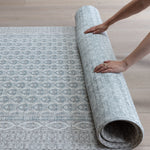 Rolling up large soft baby mat for easy storage
