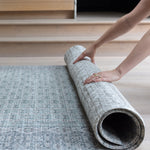 Rolling up large soft baby mat for easy storage