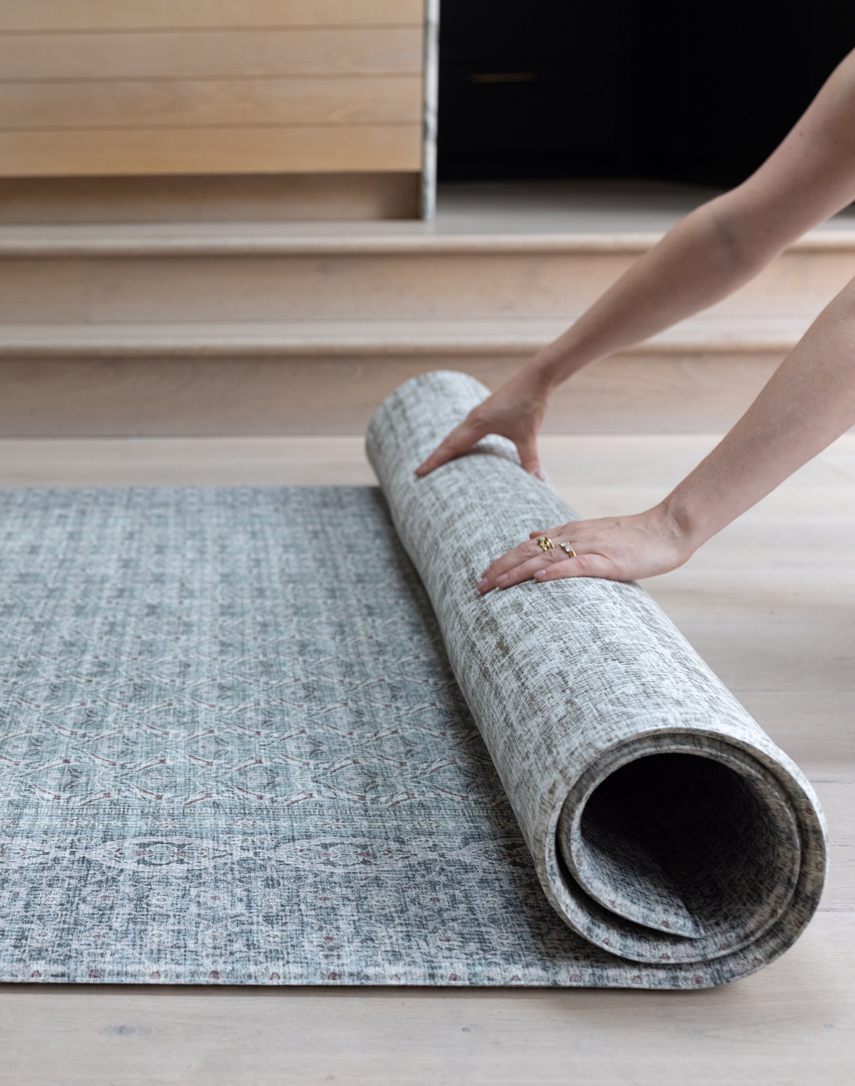 Rolling up large soft baby mat for easy storage