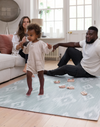 Mom, dad and toddler enjoy Baby play mat made for the whole family totter and tumble play mats are safe from birth and are perfect for the whole family to use