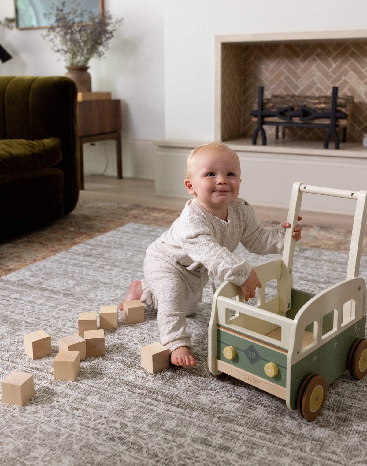 baby playing on the safe, non-toxic Petworth playmat from totter and tumble