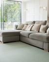 The Rambler green play mat looks chic in a neutral modern home