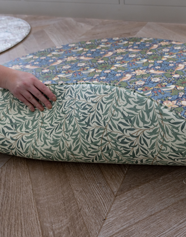Double sided round play mat by Totter and Tumble with heritage patterns by design group Morris & Co. perfect for keeping family homes stylish and added protection and support for floor play