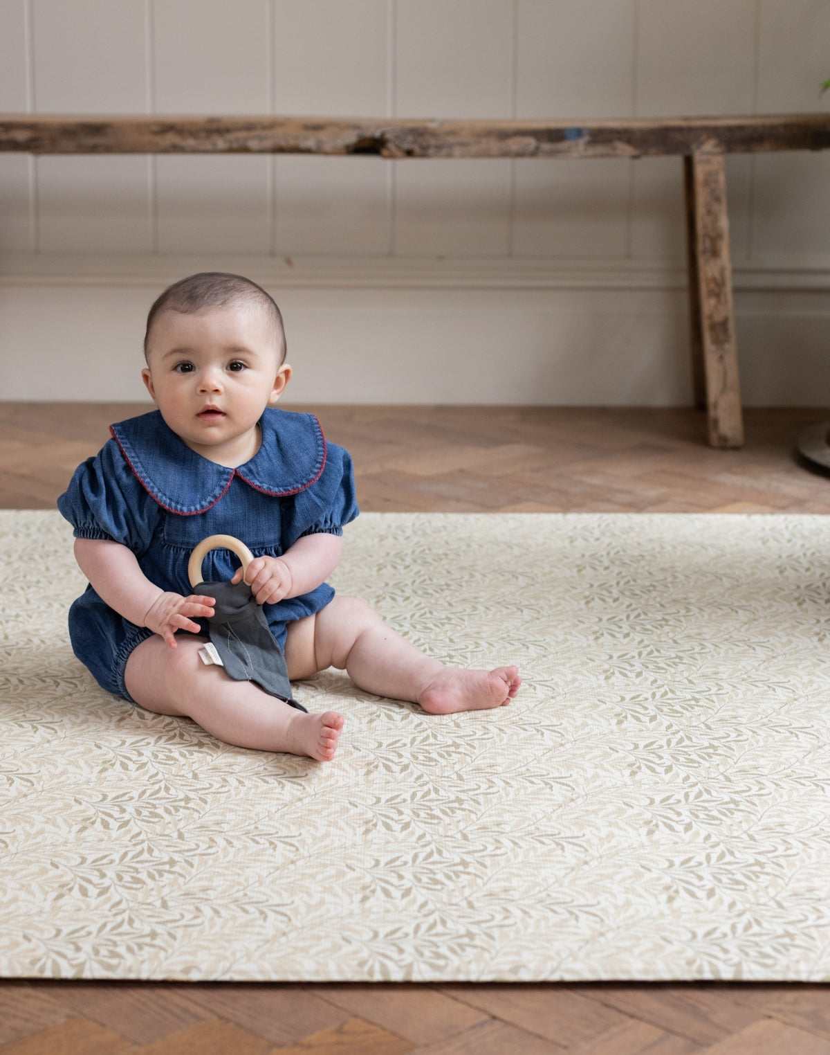 Baby sitting on a Willow Boughs Flax Totter and Tumble memory foam playmat