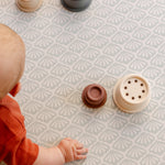 A close up on the beachcomber play mat with a baby enjoying some tummy time | SKU: 26 BEACH/GATHER XL, 26 BEACH/GATHER STD, 26 BEACH/GATHER COMP