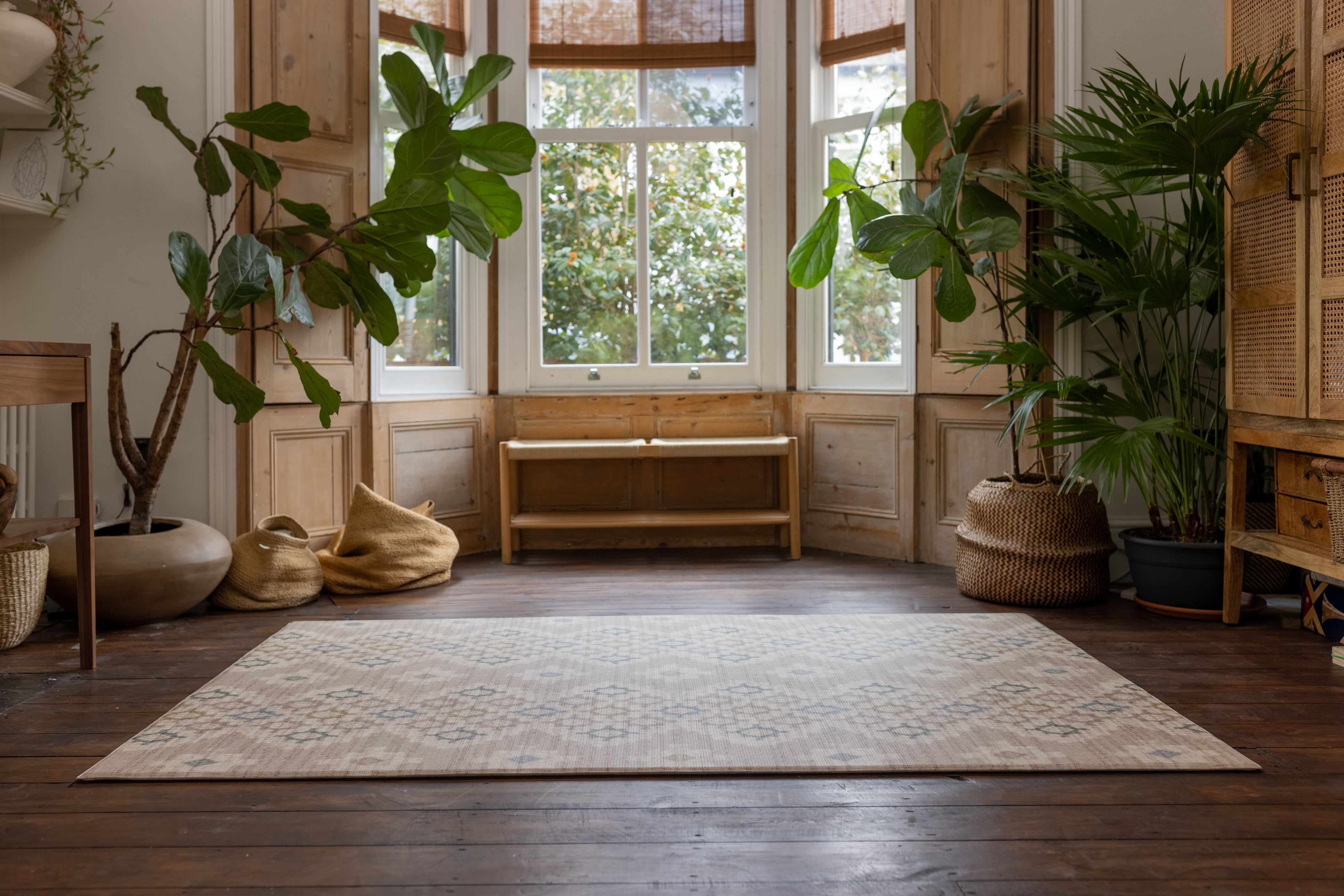 Reversible large rug-like play mat in a living room