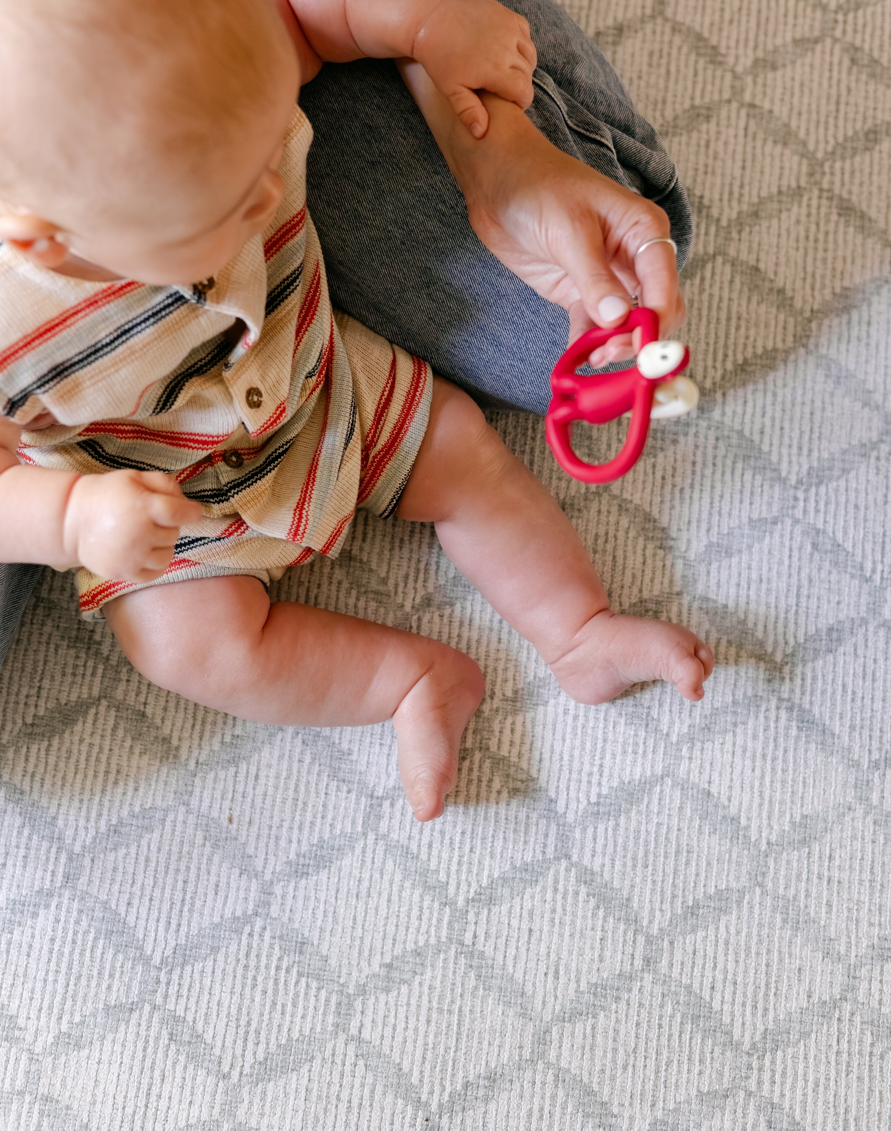 A baby sat comfortably on a coastal inspired design play mat from totter and tumble | SKU: 26 BEACH/GATHER XL, 26 BEACH/GATHER STD, 26 BEACH/GATHER COMP