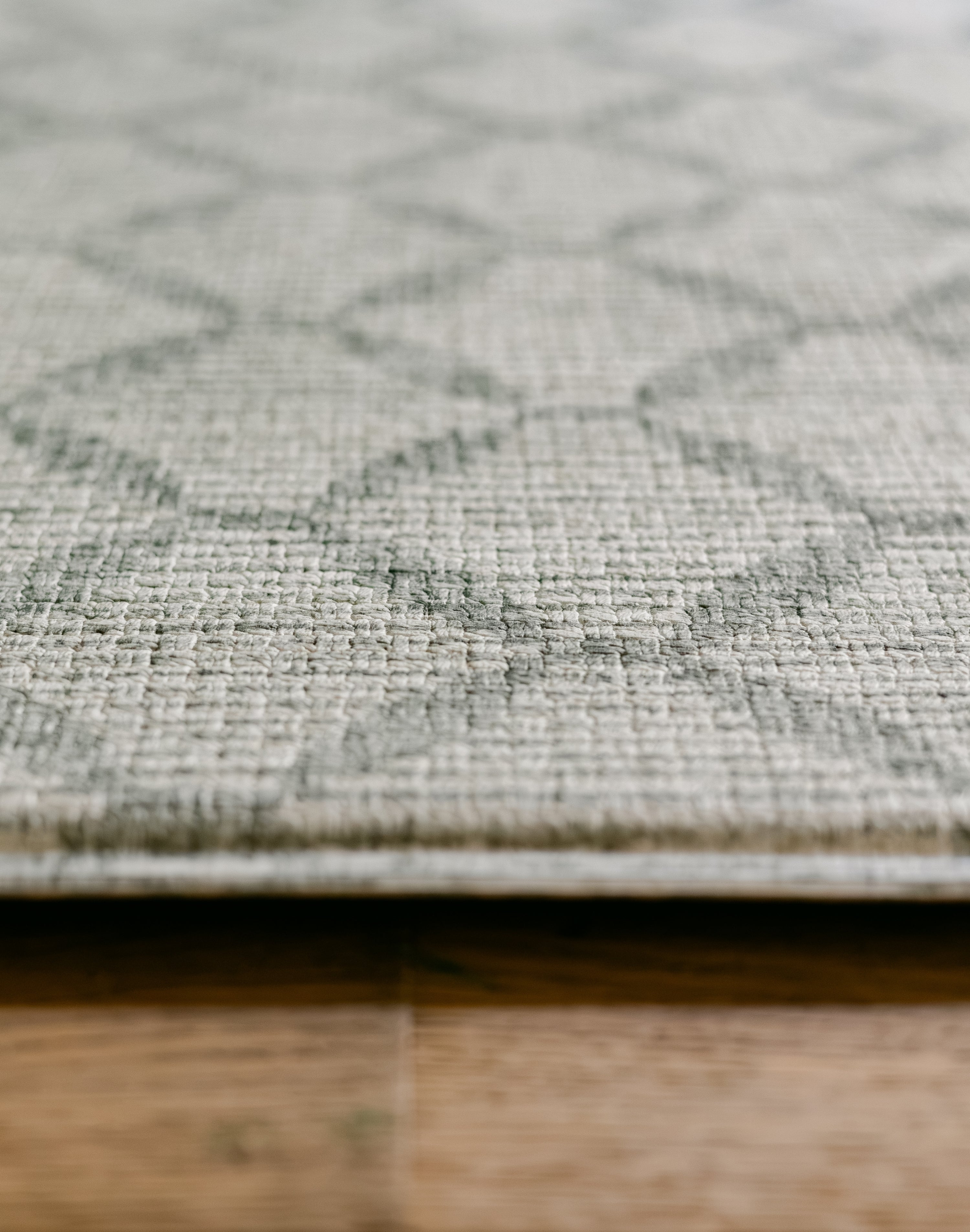Close-up of a rug-like playmat with a light geometric trellis pattern, made of thick memory foam | SKU: 26 BEACH/GATHER XL, 26 BEACH/GATHER STD, 26 BEACH/GATHER COMP