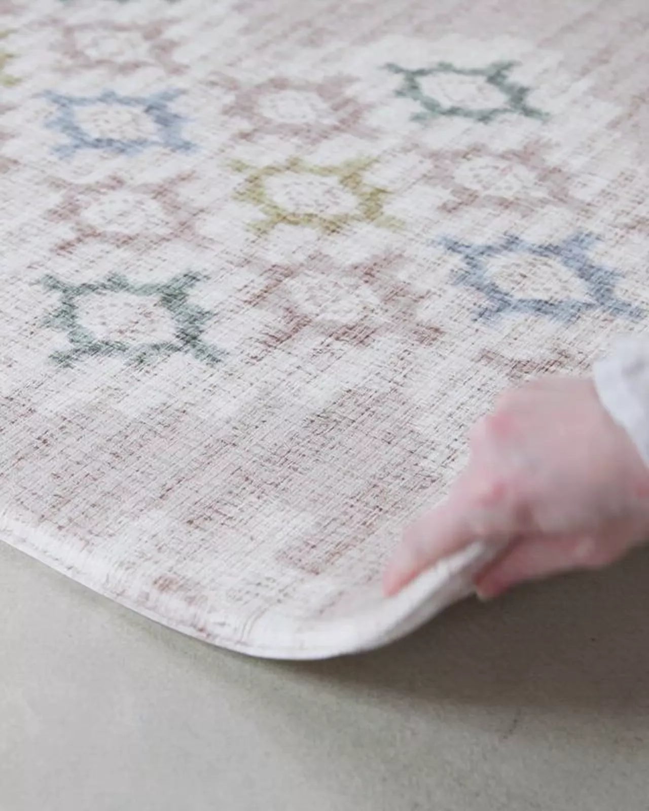 video showing geometric and floral reversible play mat in thick safe memory foam