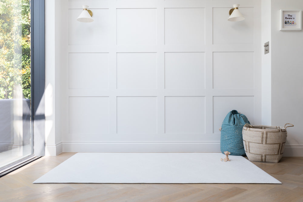 close up of totter and tumblThe Thinker lightest of the cool grey play mat botanical pattern. Modern contemporary minimal pattern luxury play mats